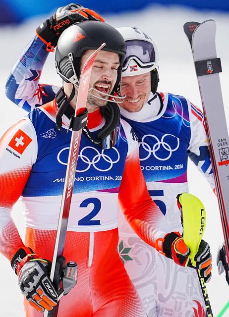 (260216) -- BORMIO, Feb. 16, 2026 (Xinhua) -- Loic Meillard (L) of Switzerland celebrates with Henrik Kristoffersen of Norway after the alpine skiing men's slalom event at the Milan-Cortina 2026 Olympic Winter Games in Bormio, Italy, Feb. 16, 2026. (Xinhua/Yan Linyun)