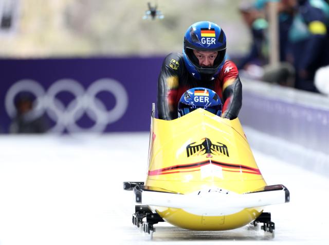 (260216) -- CORTINA D'AMPEZZO, Feb. 16, 2026 (Xinhua) -- Johannes Lochner/Georg Fleischhauer of Germany compete during the bobsleigh 2-man heat 1 at the 2026 Milan-Cortina Winter Olympics in Cortina, Italy, Feb. 15, 2026. (Xinhua/Ding Xu)