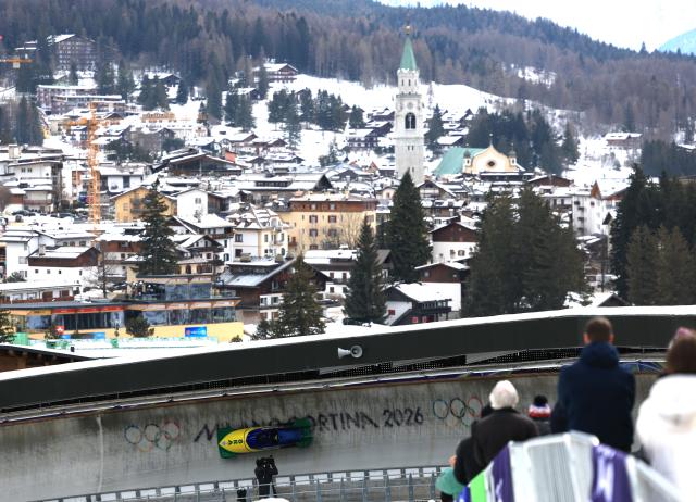 (260216) -- CORTINA D'AMPEZZO, Feb. 16, 2026 (Xinhua) -- EL Bindilatti/Luis Bacca Goncalves of Brazil compete during the bobsleigh 2-man heat 2 at the 2026 Milan-Cortina Winter Olympics in Cortina, Italy, Feb. 15, 2026. (Xinhua/Ding Xu)