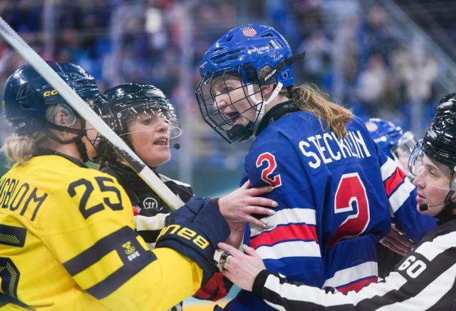 (260216) -- MILAN, Feb. 16, 2026 (Xinhua) -- Lee Stecklein (R) of the United States conflicts with Lina Ljungblom of Sweden during the ice hockey women's play-offs semifinal between the United States and Sweden at the Milan-Cortina 2026 Olympic Winter Games in Milan, Italy, Feb. 16, 2026. (Xinhua/Sun Fei)