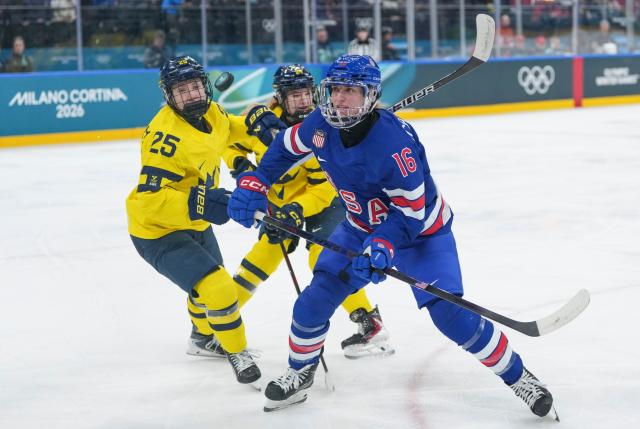 (260216) -- MILAN, Feb. 16, 2026 (Xinhua) -- Hayley Scamurra (front) of the United States competes during the ice hockey women's play-offs semifinal between the United States and Sweden at the Milan-Cortina 2026 Olympic Winter Games in Milan, Italy, Feb. 16, 2026. (Xinhua/Sun Fei)