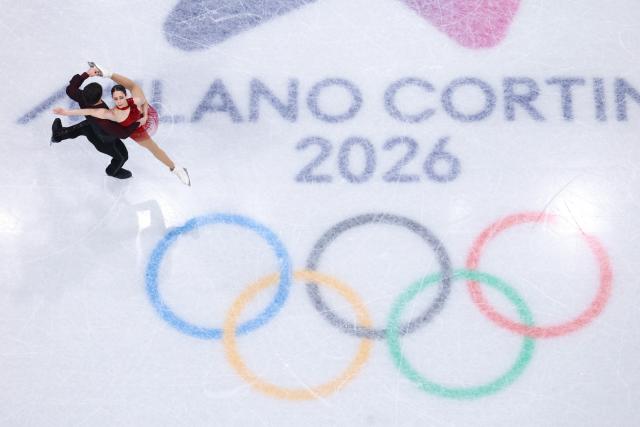 (260216) -- MILAN, Feb. 16, 2026 (Xinhua) -- Deanna Stellato-Dudek (R)/Maxime Deschamps of Canada compete during the figure skating pair skating free skating match at the Milan-Cortina 2026 Olympic Winter Games in Milan, Italy, Feb. 15, 2026. (Xinhua/Chen Yichen)