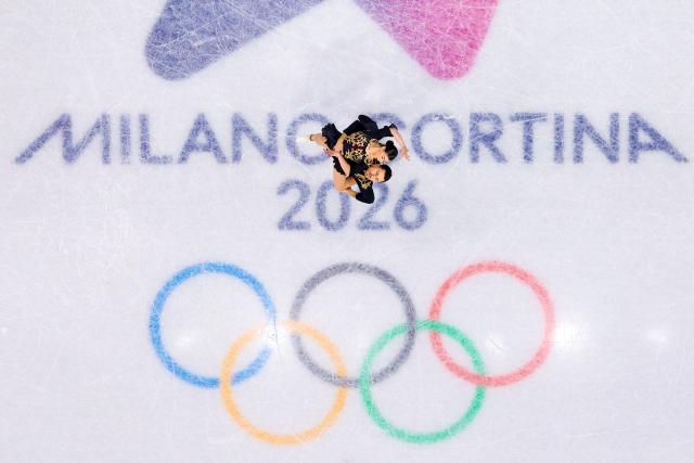 (260216) -- MILAN, Feb. 16, 2026 (Xinhua) -- Rebecca Ghilardi (top)/Filippo Ambrosini of Italy compete during the figure skating pair skating free skating match at the Milan-Cortina 2026 Olympic Winter Games in Milan, Italy, Feb. 15, 2026. (Xinhua/Chen Yichen)