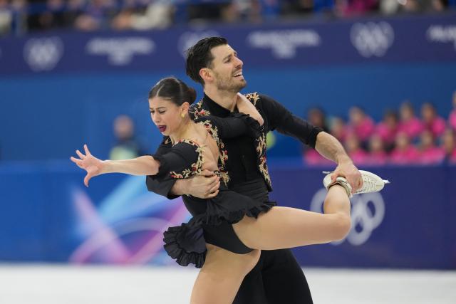 (260216) -- MILAN, Feb. 16, 2026 (Xinhua) -- Rebecca Ghilardi (L)/Filippo Ambrosini of Italy compete during the figure skating pair skating free skating match at the Milan-Cortina 2026 Olympic Winter Games in Milan, Italy, Feb. 15, 2026. (Xinhua/Xue Yuge)