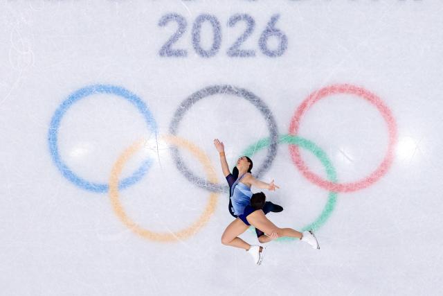 (260216) -- MILAN, Feb. 16, 2026 (Xinhua) -- Anastasia Vaipan-Law (above)/Luke Digby of Britain compete during the figure skating pair skating free skating match at the Milan-Cortina 2026 Olympic Winter Games in Milan, Italy, Feb. 15, 2026. (Xinhua/Chen Yichen)