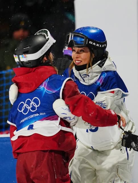 (260216) -- LIVIGNO, Feb. 16, 2026 (Xinhua) -- Gu Ailing (R) of China hugs Megan Oldham of Canada after the freestyle skiing women's freeski big air final at the Milan-Cortina 2026 Olympic Winter Games in Livigno, Italy, Feb. 16, 2026. (Xinhua/Hu Chao)