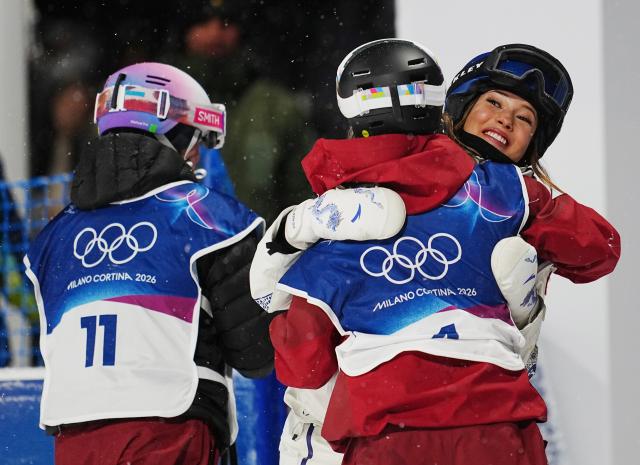 (260216) -- LIVIGNO, Feb. 16, 2026 (Xinhua) -- Gu Ailing (R) of China hugs Megan Oldham of Canada after the freestyle skiing women's freeski big air final at the Milan-Cortina 2026 Olympic Winter Games in Livigno, Italy, Feb. 16, 2026. (Xinhua/Hu Chao)