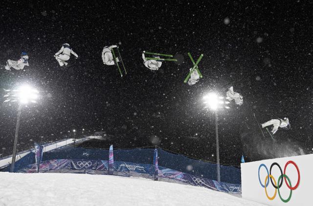 (260216) -- LIVIGNO, Feb. 16, 2026 (Xinhua) -- This multi-exposure photo shows Gu Ailing of China competing during the freestyle skiing women's freeski big air final at the Milan-Cortina 2026 Olympic Winter Games in Livigno, Italy, Feb. 16, 2026. (Xinhua/Xia Yifang)