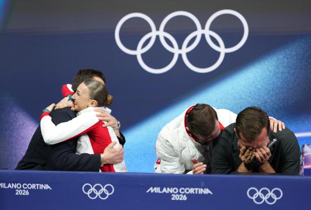 (260217) -- MILAN, Feb. 17, 2026 (Xinhua) -- Anastasiia Metelkina/Luka Berulava of Georgia and their coaches react in the kiss and cry area after their free skating performance of Figure Skating Pair Skating at the Milan-Cortina 2026 Olympic Winter Games in Milan, Italy, Feb. 16, 2026. (Xinhua/Xue Yuge)