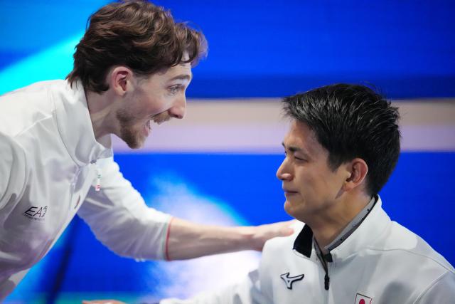 (260217) -- MILAN, Feb. 17, 2026 (Xinhua) -- Ryuichi Kihara(R) of Japan is congratulated by Niccolo Macii of Italy after Group 3 competition of the free skating of Figure Skating Pair Skating at the Milan-Cortina 2026 Olympic Winter Games in Milan, Italy, Feb. 16, 2026. (Xinhua/Xue Yuge)