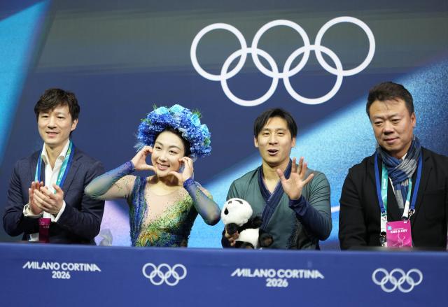 (260217) -- MILAN, Feb. 17, 2026 (Xinhua) -- Sui Wenjing/Han Cong of China react in the kiss and cry area after their free skating performance of Figure Skating Pair Skating at the Milan-Cortina 2026 Olympic Winter Games in Milan, Italy, Feb. 16, 2026. (Xinhua/Xue Yuge)