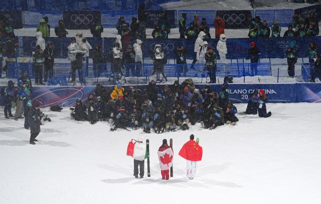 (260217) -- LIVIGNO, Feb. 17, 2026 (Xinhua) -- Gold medalist Megan Oldham (C, Front) of Canada, silver medalist Gu Ailing (R, Front) of China, and bronze medalist Flora Tabanelli of Italy attend the awarding ceremony of the freestyle skiing women's freeski big air event at the Milan-Cortina 2026 Olympic Winter Games in Livigno, Italy, Feb. 16, 2026. (Xinhua/Wu Huiwo)