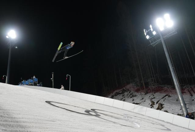 (260217) -- PREDAZZO, Feb. 17, 2026 (Xinhua) -- Kristoffer Eriksen Sundal of Norway competes during the trial round of the ski jumping men's super team event at the Milan-Cortina 2026 Olympic Winter Games in Predazzo, Italy, Feb. 16, 2026. (Xinhua/Meng Yongmin)