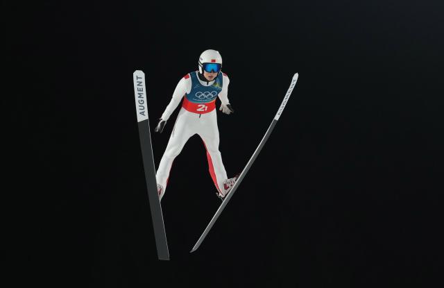 (260217) -- PREDAZZO, Feb. 17, 2026 (Xinhua) -- Song Qiwu of China competes during the first round of the ski jumping men's super team event at the Milan-Cortina 2026 Olympic Winter Games in Predazzo, Italy, Feb. 16, 2026. (Xinhua/Meng Yongmin)