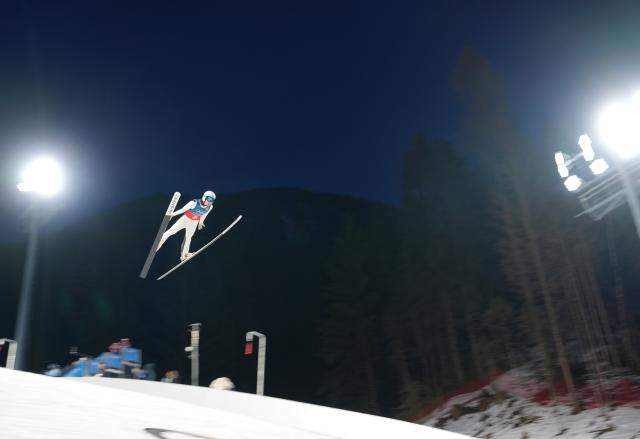(260217) -- PREDAZZO, Feb. 17, 2026 (Xinhua) -- Song Qiwu of China competes during the trial round of the ski jumping men's super team event at the Milan-Cortina 2026 Olympic Winter Games in Predazzo, Italy, Feb. 16, 2026. (Xinhua/Meng Yongmin)