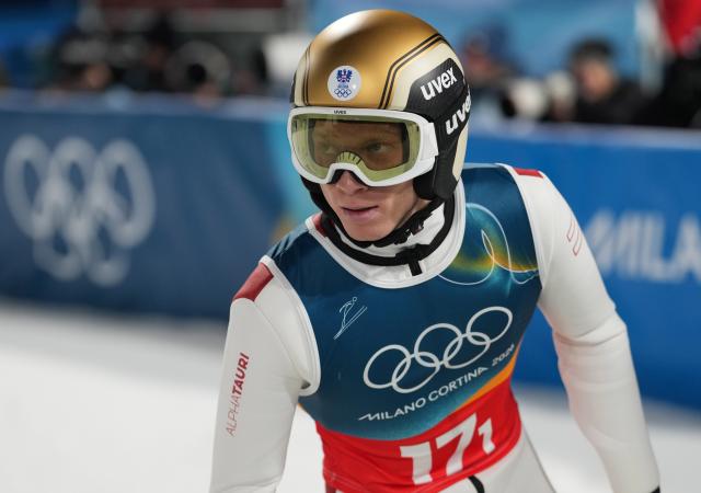 (260217) -- PREDAZZO, Feb. 17, 2026 (Xinhua) -- Jan Hoerl of Austria celebrates after the second round of the ski jumping men's super team event at the Milan-Cortina 2026 Olympic Winter Games in Predazzo, Italy, Feb. 16, 2026. (Xinhua/Meng Yongmin)