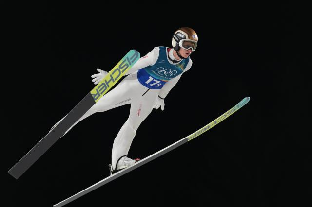 (260217) -- PREDAZZO, Feb. 17, 2026 (Xinhua) -- Stephan Embacher of Austria competes during the first round of the ski jumping men's super team event at the Milan-Cortina 2026 Olympic Winter Games in Predazzo, Italy, Feb. 16, 2026. (Xinhua/Meng Yongmin)