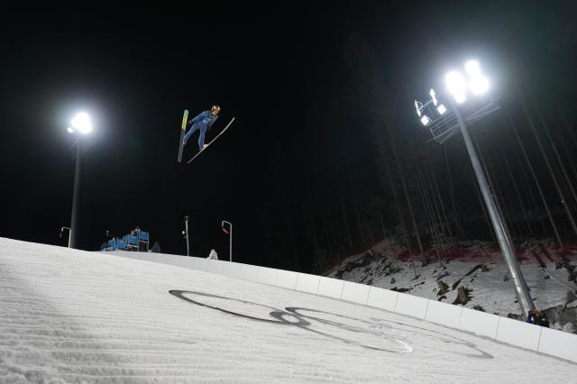 (260217) -- PREDAZZO, Feb. 17, 2026 (Xinhua) -- Kacper Tomasiak of Poland competes during the first round of the ski jumping men's super team event at the Milan-Cortina 2026 Olympic Winter Games in Predazzo, Italy, Feb. 16, 2026. (Xinhua/Meng Yongmin)