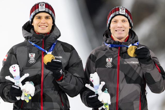(260217) -- PREDAZZO, Feb. 17, 2026 (Xinhua) -- Gold medalist Team Austria pose on the podium after the ski jumping men's super team event at the Milan-Cortina 2026 Olympic Winter Games in Predazzo, Italy, Feb. 16, 2026. (Xinhua/Huang Wei)