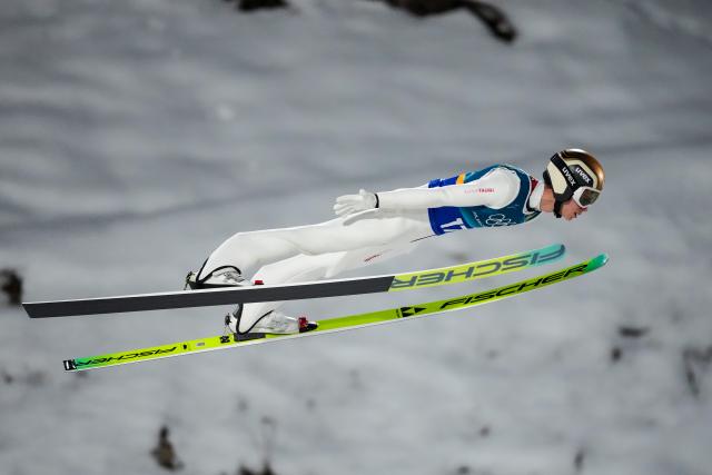 (260217) -- PREDAZZO, Feb. 17, 2026 (Xinhua) -- Stephan Embacher of Austria competes during the first round of the ski jumping men's super team event at the Milan-Cortina 2026 Olympic Winter Games in Predazzo, Italy, Feb. 16, 2026. (Xinhua/Huang Wei)