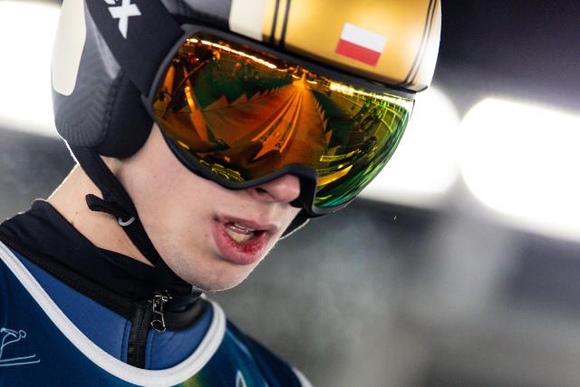 (260217) -- PREDAZZO, Feb. 17, 2026 (Xinhua) -- Kacper Tomasiak of Poland competes during the trial round of the ski jumping men's super team event at the Milan-Cortina 2026 Olympic Winter Games in Predazzo, Italy, Feb. 16, 2026. (Xinhua/Huang Wei)