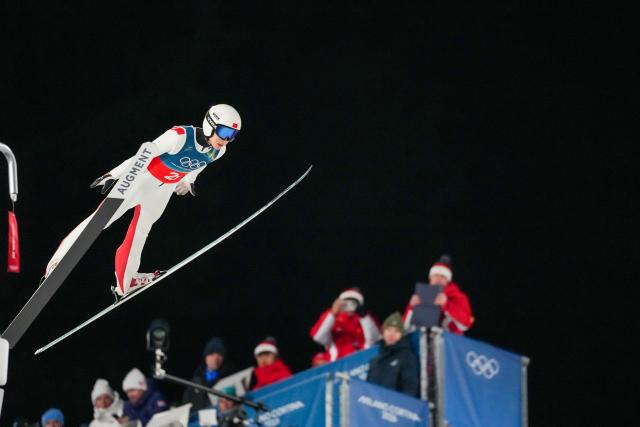 (260217) -- PREDAZZO, Feb. 17, 2026 (Xinhua) -- Song Qiwu of China competes during the first round of the ski jumping men's super team event at the Milan-Cortina 2026 Olympic Winter Games in Predazzo, Italy, Feb. 16, 2026. (Xinhua/Huang Wei)