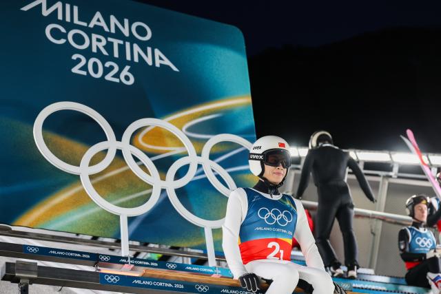 (260217) -- PREDAZZO, Feb. 17, 2026 (Xinhua) -- Song Qiwu of China competes during the trial round of the ski jumping men's super team event at the Milan-Cortina 2026 Olympic Winter Games in Predazzo, Italy, Feb. 16, 2026. (Xinhua/Huang Wei)
