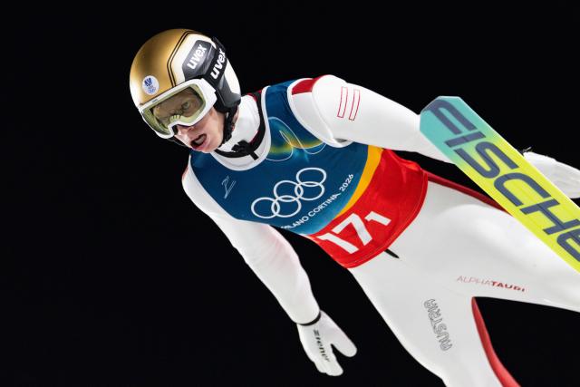 (260217) -- PREDAZZO, Feb. 17, 2026 (Xinhua) -- Jan Hoerl of Austria competes during the second round of the ski jumping men's super team event at the Milan-Cortina 2026 Olympic Winter Games in Predazzo, Italy, Feb. 16, 2026. (Xinhua/Huang Wei)