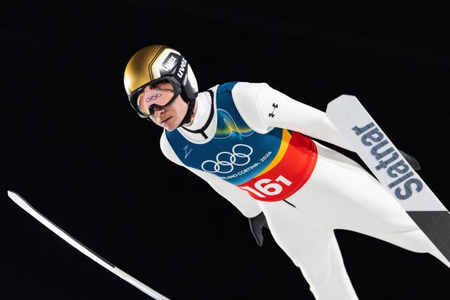 (260217) -- PREDAZZO, Feb. 17, 2026 (Xinhua) -- Anze Lanisek of Slovenia competes during the second round of the ski jumping men's super team event at the Milan-Cortina 2026 Olympic Winter Games in Predazzo, Italy, Feb. 16, 2026. (Xinhua/Huang Wei)