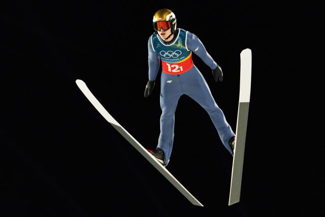 (260217) -- PREDAZZO, Feb. 17, 2026 (Xinhua) -- Pawel Wasek of Poland competes during the second round of the ski jumping men's super team event at the Milan-Cortina 2026 Olympic Winter Games in Predazzo, Italy, Feb. 16, 2026. (Xinhua/Huang Wei)