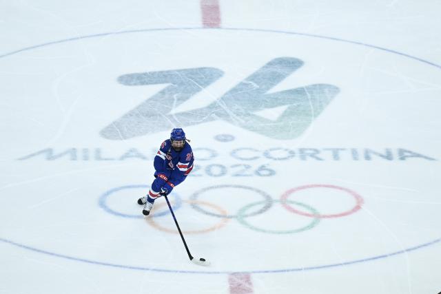 (260217) -- MILAN, Feb. 17, 2026 (Xinhua) -- Kendall Coyne (26) of the United States moves the puck during the Play-offs Semifinals match between the United States and Sweden of Ice hockey Women at the Milan-Cortina 2026 Olympic Winter Games in Milan, Italy, Feb. 16, 2026. (Xinhua/Zhang Haofu)