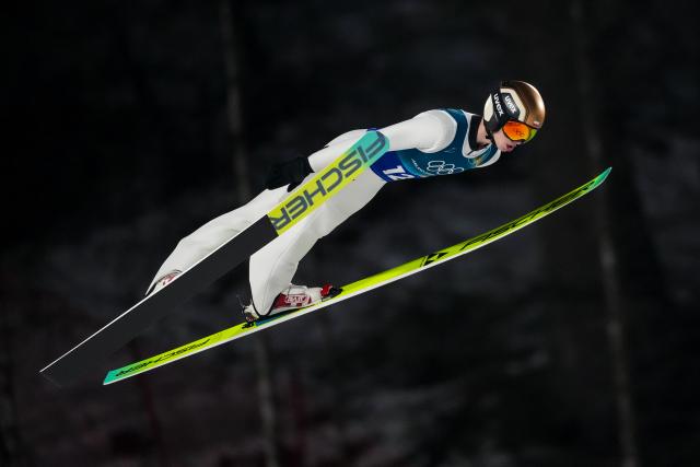(260217) -- PREDAZZO, Feb. 17, 2026 (Xinhua) -- Kacper Tomasiak of Poland competes during the first round of the ski jumping men's super team event at the Milan-Cortina 2026 Olympic Winter Games in Predazzo, Italy, Feb. 16, 2026. (Xinhua/Huang Wei)