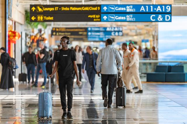 (260217) -- ADDIS ABABA, Feb. 17, 2026 (Xinhua) -- People walk at the Addis Ababa Bole International Airport in Addis Ababa, Ethiopia, Feb. 16, 2026. Addis Ababa, the capital of Ethiopia, whose name means "new flower" in Amharic, is located in the country's central highlands and enjoys a mild and pleasant climate. Home to rich cultural heritage and historical sites, the city also hosts the headquarters of the African Union, making it an important hub for multilateral diplomacy in Africa. (Xinhua/Xie Jianfei)