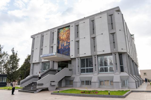(260217) -- ADDIS ABABA, Feb. 17, 2026 (Xinhua) -- A man takes photos outside the National Museum of Ethiopia in Addis Ababa, Ethiopia, Feb. 12, 2026. Addis Ababa, the capital of Ethiopia, whose name means "new flower" in Amharic, is located in the country's central highlands and enjoys a mild and pleasant climate. Home to rich cultural heritage and historical sites, the city also hosts the headquarters of the African Union, making it an important hub for multilateral diplomacy in Africa. (Xinhua/Xie Jianfei)