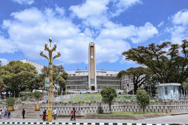 (260217) -- ADDIS ABABA, Feb. 17, 2026 (Xinhua) -- People pass by Addis Ababa City Council in Addis Ababa, Ethiopia, Feb. 12, 2026. Addis Ababa, the capital of Ethiopia, whose name means "new flower" in Amharic, is located in the country's central highlands and enjoys a mild and pleasant climate. Home to rich cultural heritage and historical sites, the city also hosts the headquarters of the African Union, making it an important hub for multilateral diplomacy in Africa. (Xinhua/Geng Xinning)