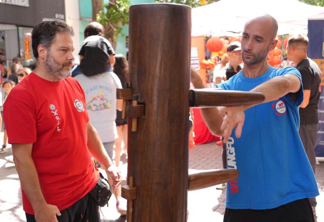 (260217) -- BUENOS AIRES, Feb. 17, 2026 (Xinhua) -- People experience martial arts during a Spring Festival celebration in the Chinatown in Buenos Aires, capital of Argentina, Feb. 16, 2026. The event kicked off on Monday, featuring dragon and lion dances, traditional Chinese dance performances, as well as cultural experience activities such as martial arts and calligraphy. (Xinhua/Zhang Duo)