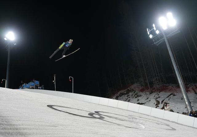 (260217) -- PREDAZZO, Feb. 17, 2026 (Xinhua) -- Stephan Embacher of team Austria competes during the trial round of the ski jumping men's super team event at the Milan-Cortina 2026 Olympic Winter Games in Predazzo, Italy, Feb. 16, 2026. (Xinhua/Meng Yongmin)