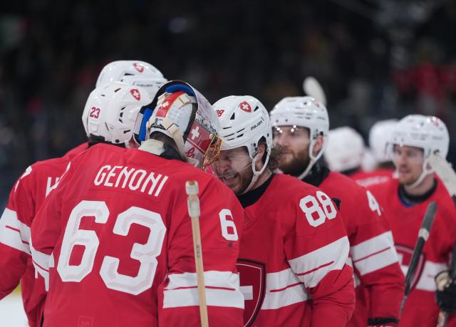 (260217) -- MILANMILAN, Feb. 17, 2026 (Xinhua) -- Players of Switzerland celebrate after the ice hockey men's qualification play-off round match between Switzerland and Italy at the Milan-Cortina 2026 Olympic Winter Games in Milan, Italy, Feb. 17, 2026. (Xinhua/Tao Xiyi)