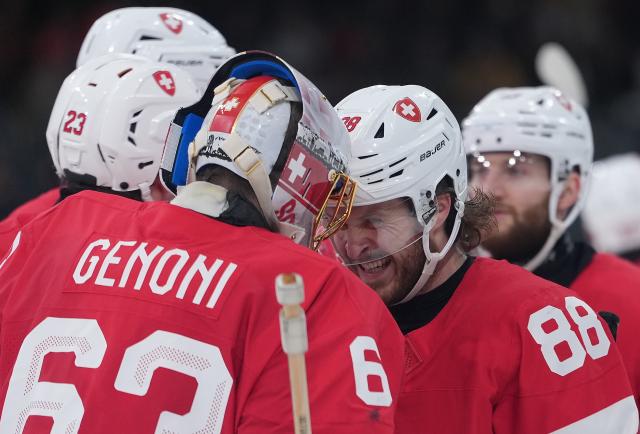 (260217) -- MILANMILAN, Feb. 17, 2026 (Xinhua) -- Players of Switzerland celebrate after the ice hockey men's qualification play-off round match between Switzerland and Italy at the Milan-Cortina 2026 Olympic Winter Games in Milan, Italy, Feb. 17, 2026. (Xinhua/Tao Xiyi)