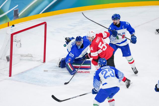 (260217) -- MILAN, Feb. 17, 2026 (Xinhua) -- Christian Marti (2nd L) of Switzerland competes during the ice hockey men's qualification play-off round match between Switzerland and Italy at the Milan-Cortina 2026 Olympic Winter Games in Milan, Italy, Feb. 17, 2026. (Xinhua/Sun Fei)