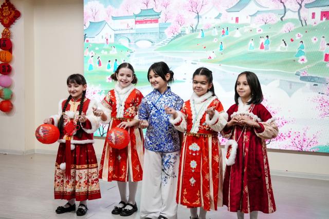 (260217) -- DUSHANBE, Feb. 17, 2026 (Xinhua) -- Children display traditional Chinese clothes at the Confucius Institute at Tajik National University during a Chinese New Year cultural event in Dushanbe, Tajikistan, on Feb. 16, 2026. (Confucius Institute at Tajik National University/Handout via Xinhua)