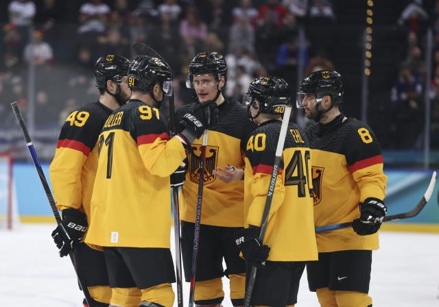 (260217) -- MILAN, Feb. 17, 2026 (Xinhua) -- Players of Germany communicate during the ice hockey men's qualification play-off match between Germany and France at the Milan-Cortina 2026 Olympic Winter Games in Milan, Italy, Feb. 17, 2026. (Xinhua/Wang Kaiyan)