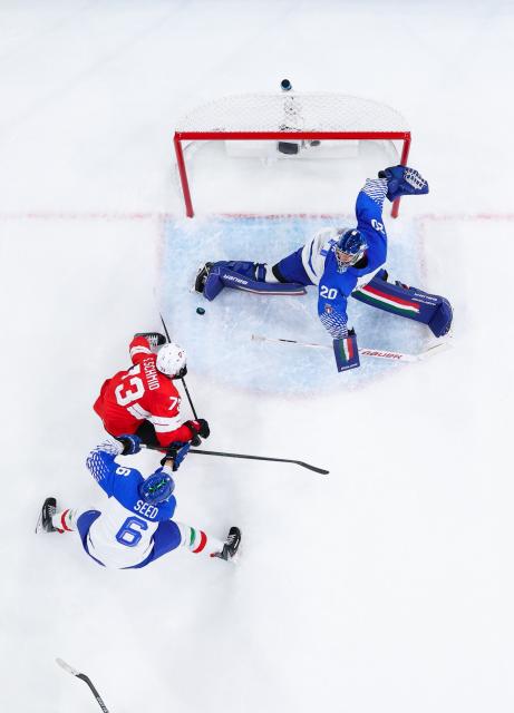 (260217) -- MILAN, Feb. 17, 2026 (Xinhua) -- Damian Clara (top) of Italy makes a save during the ice hockey men's qualification play-off round match between Switzerland and Italy at the Milan-Cortina 2026 Olympic Winter Games in Milan, Italy, Feb. 17, 2026. (Xinhua/Tao Xiyi)