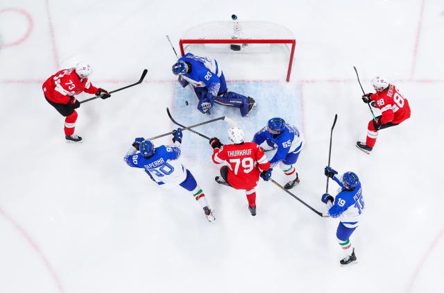 (260217) -- MILAN, Feb. 17, 2026 (Xinhua) -- Damian Clara (C, top) of Italy makes a save during the ice hockey men's qualification play-off round match between Switzerland and Italy at the Milan-Cortina 2026 Olympic Winter Games in Milan, Italy, Feb. 17, 2026. (Xinhua/Tao Xiyi)