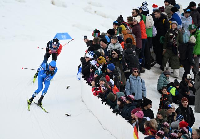 (260217) -- TESERO, Feb. 17, 2026 (Xinhua) -- Athletes compete during the cross-country event of Nordic Combined Individual Gundersen Large Hill/10km at the Milan-Cortina 2026 Olympic Winter Games in Tesero, Italy, Feb. 17, 2026. (Xinhua/He Canling)