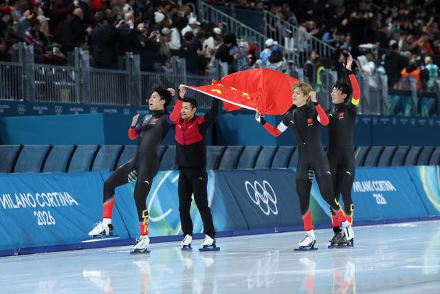 (260217) -- MILAN, Feb. 17, 2026 (Xinhua) -- Liu Hanbin, Wu Yu, Li Wenhao and Ning Zhongyan of China celebrate after the speed skating men's team pursuit final B between China and the Netherlands at the Milan-Cortina 2026 Olympic Winter Games in Milan, Italy, Feb. 17, 2026. (Xinhua/Li Jing)