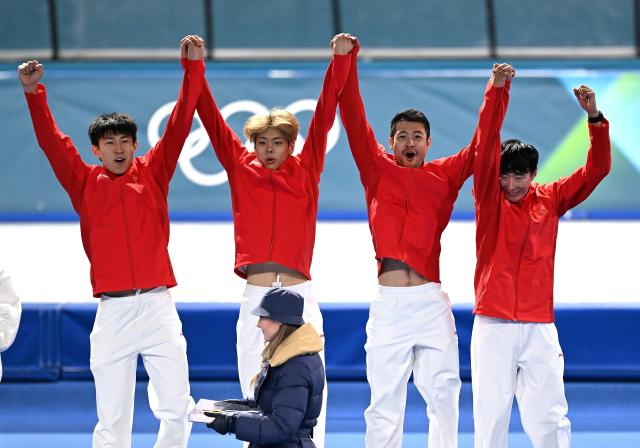 (260217) -- MILAN, Feb. 17, 2026 (Xinhua) -- Bronze medalists Liu Hanbin, Wu Yu, Li Wenhao and Ning Zhongyan of China celebrate during the awarding ceremony of the speed skating men's team pursuit event at the Milan-Cortina 2026 Olympic Winter Games in Milan, Italy, Feb. 17, 2026. (Xinhua/Wu Wei)