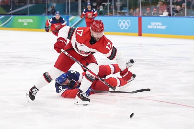 (260217) -- MILAN, Feb. 17, 2026 (Xinhua) -- Nicklas Jensen (front) of Denmark competes during the ice hockey men's qualification play-off match between the Czech Republic and Denmark at the Milan-Cortina 2026 Olympic Winter Games in Milan, Italy, Feb. 17, 2026. (Xinhua/Wang Kaiyan)