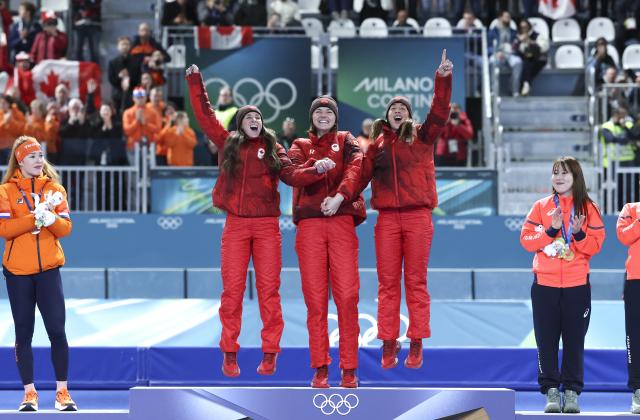 (260217) -- MILAN, Feb. 17, 2026 (Xinhua) -- Gold medalists Ivanie Blondin, Valerie Maltais and Isabelle Weidemann of Canada celebrate during the awarding ceremony of the speed skating women's team pursuit event at the Milan-Cortina 2026 Olympic Winter Games in Milan, Italy, Feb. 17, 2026. (Xinhua/Li Jing)