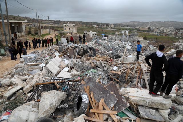(260217) -- BETHLEHEM, Feb. 17, 2026 (Xinhua) -- Palestinians inspect the damage after Israeli excavators demolished a building in the town of al-Khader, south of Bethlehem in the West Bank, Feb. 17, 2026. (Photo by Mamoun Wazwaz/Xinhua)